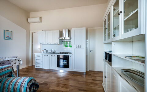 Feriebolig Timone: Frokostlokale, Køkken, Stue